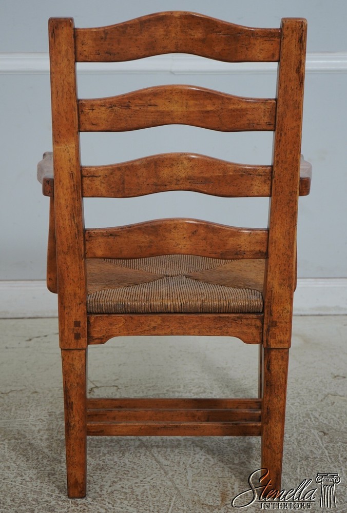 68471: Pair GUY CHADDOCK Distressed Ladderback Armchairs