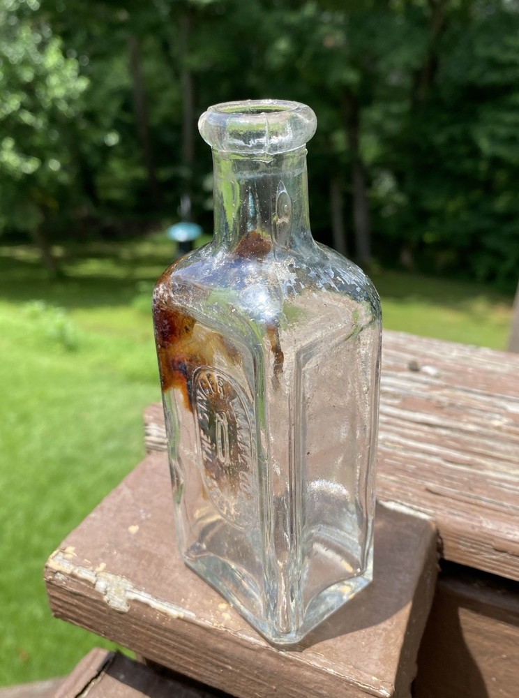 The Singer Sewing Machine Co Bottle
