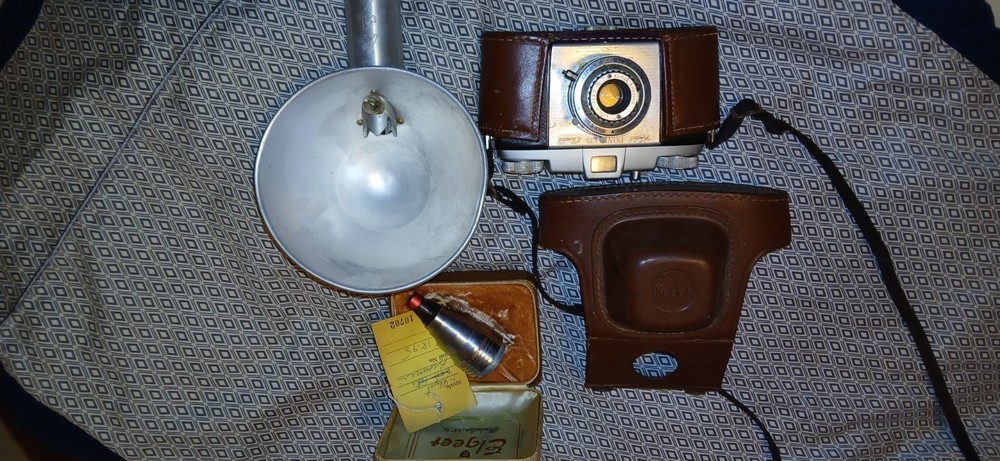 Vintage Camera,Lens, And Flash Bulb.
