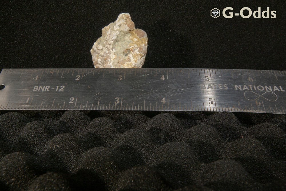 Rare broken geode around 2" with iron oxide and quartz