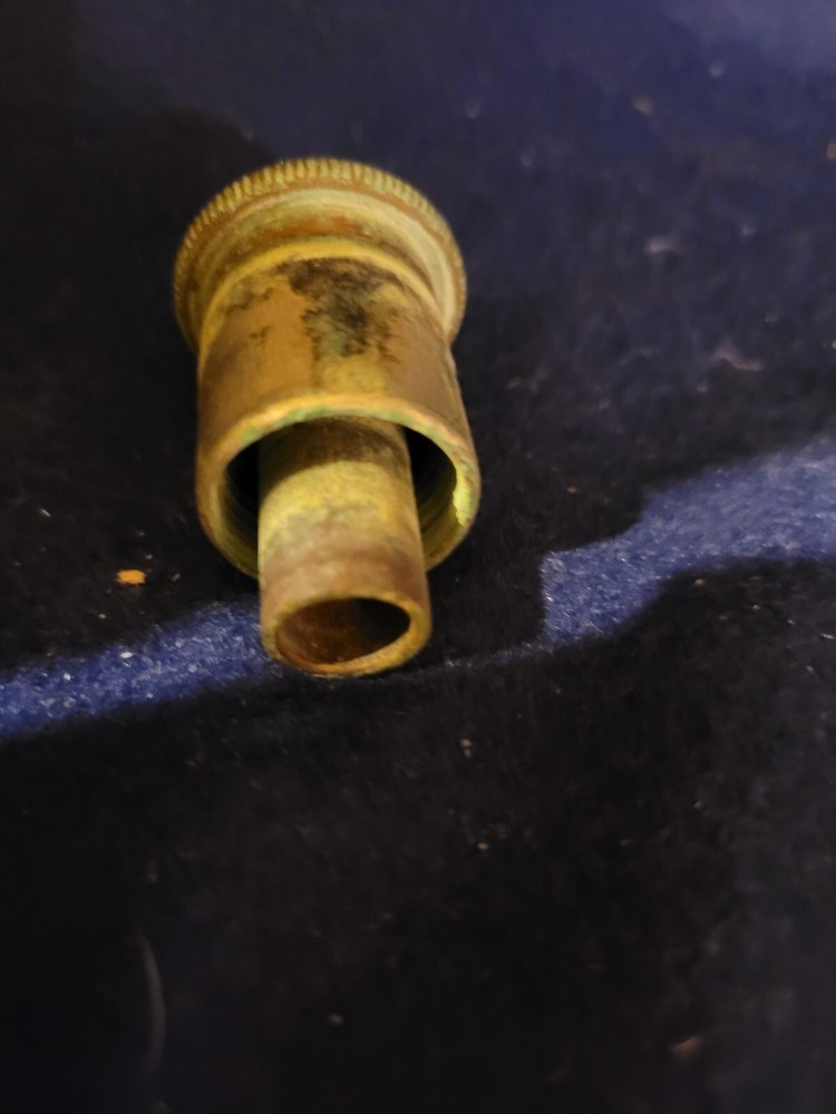 Antique cold water actuator for hotel sink.