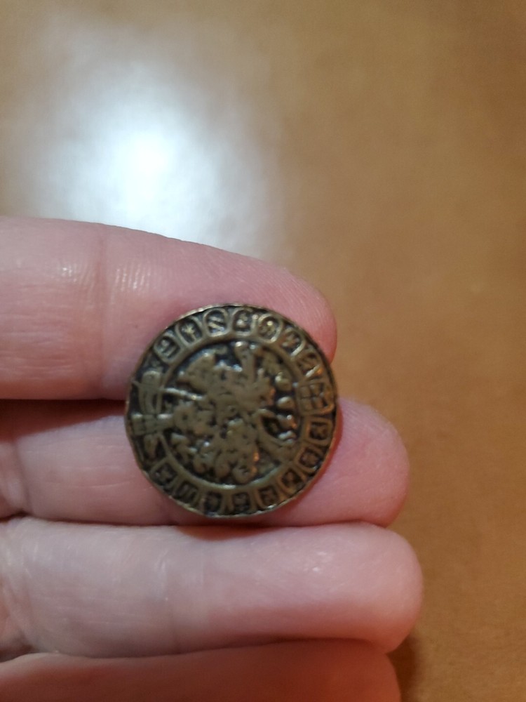 4 miscellaneous antique brass buttons