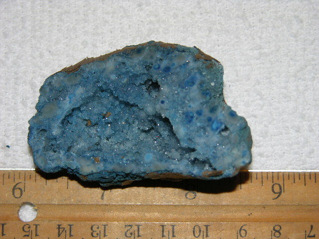 Geode cut & polished half with colored crystal center 2.5 inch E31