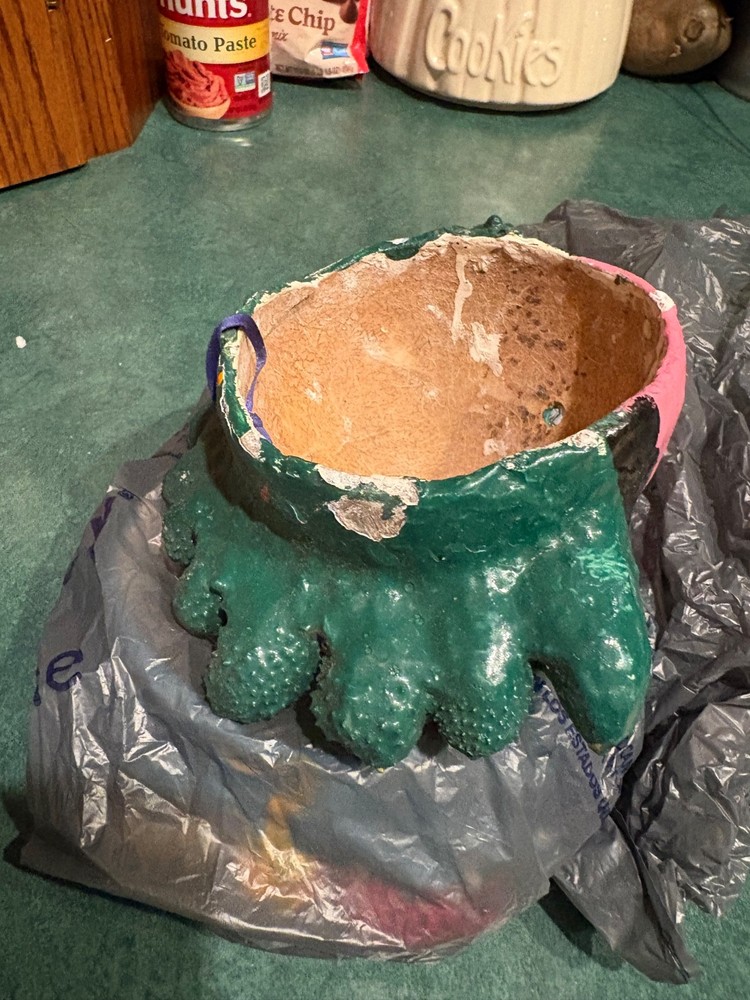 2 primitive string holders. Looks to be handmade.