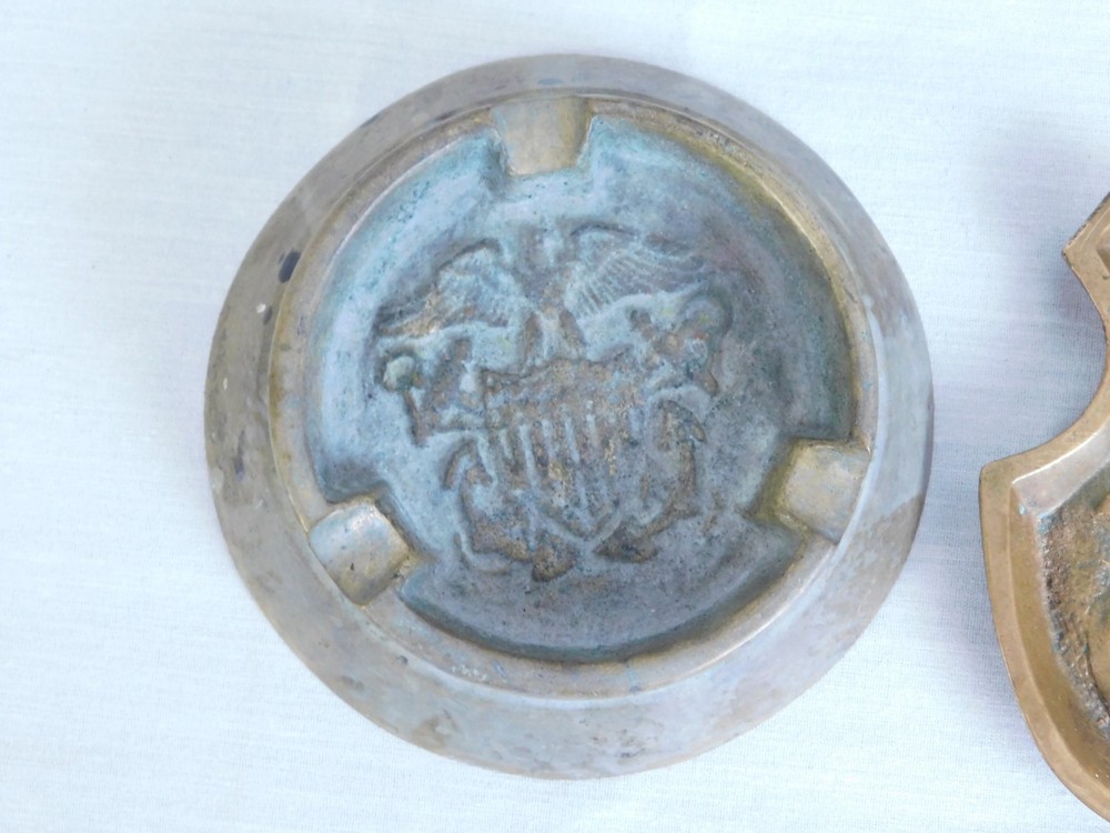Two Early 20th C. Solid Brass Ashtrays - US Eagle Shield & Naughty Officer