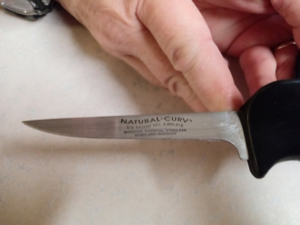 Unique NATURAL-CURV deboning knife. Wrap around rubber handle.