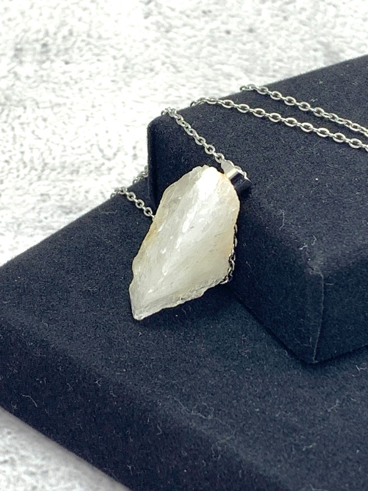 Japanese natural quartz crystal with orange inclusions