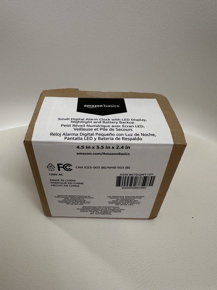 Amazon Basics Small Digital Oval Alarm Clock with LED Display, Nightlight & Batt