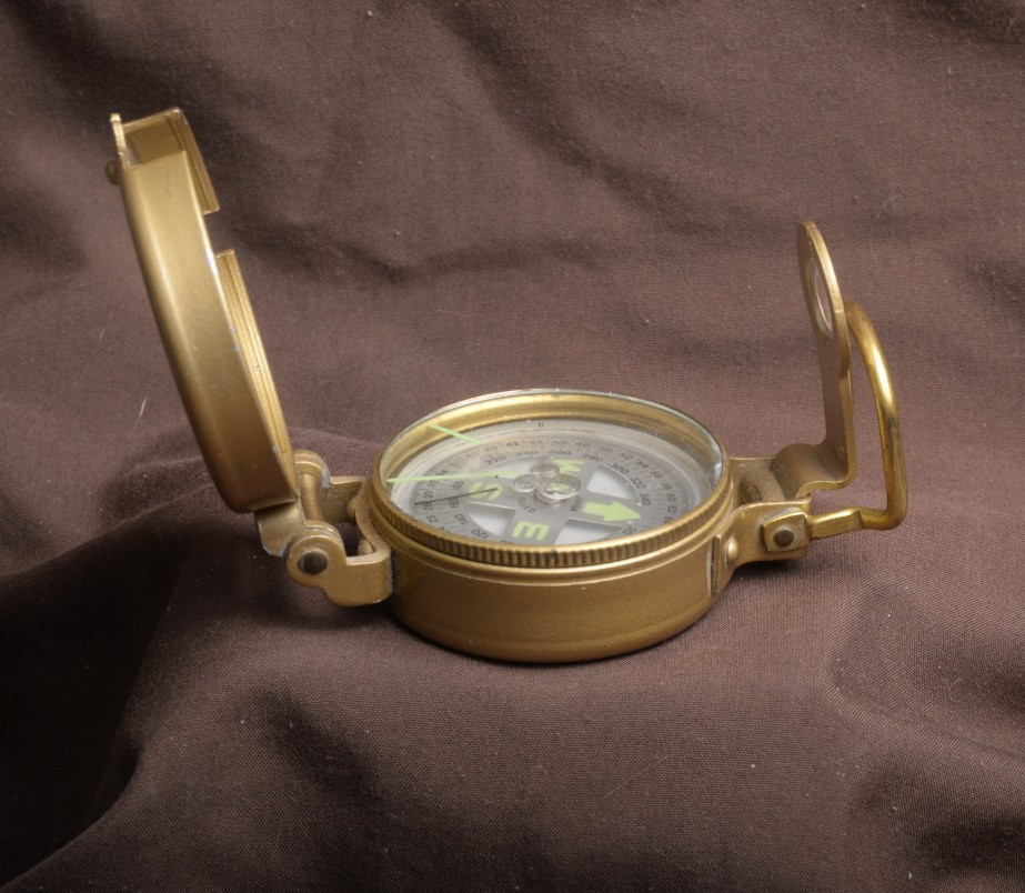 two lensatic compasses one with box