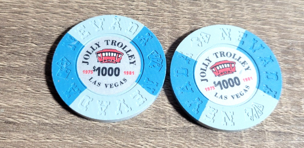2 PIECE OBSOLETE JOLLY TROLLEY COMMEMORATIVE $1000 CHIPS NCV
