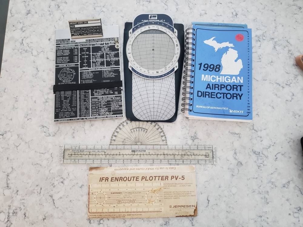 Sporty’s E6B electronic flight computer and Aviation slide computers plates