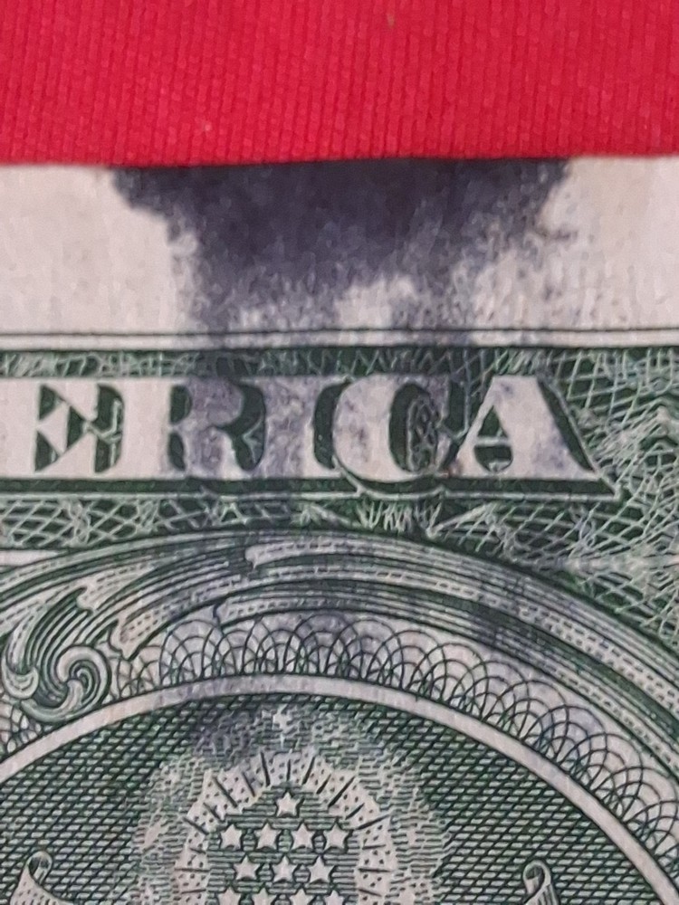 $1 Ink Smear Error with Bleed Through