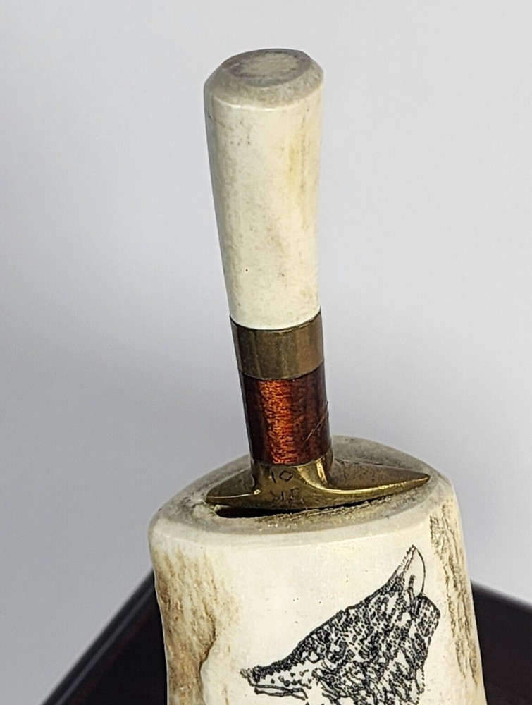 Small Knife In Bone looking Holder With Wolf On