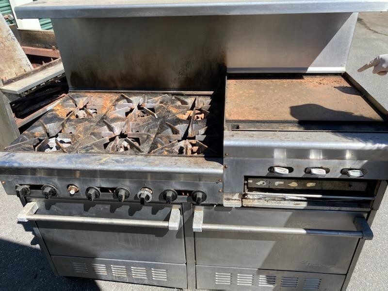 6 Burner US Range. Double oven,  24 in. Flat top.Needs casters and work.
