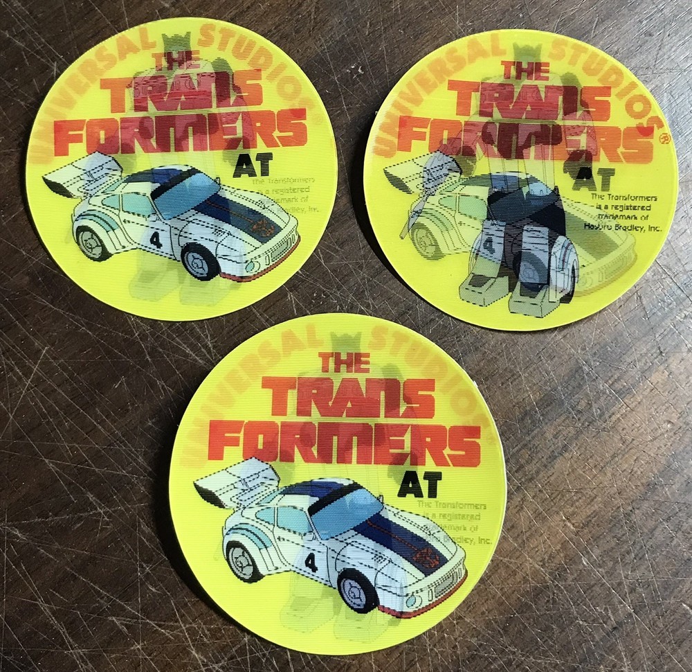 VTG G1 TRANSFORMERS UNIVERSAL STUDIOS DUAL LENTICULAR PIN BACK/BUTTON 1985 JAZZ
