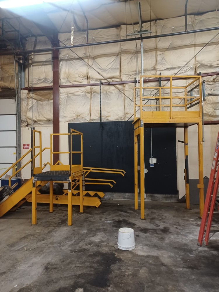 STEEL CONSTRUCTED MEZZANINE | COLOR: YELLOW | MULTI-LEVEL | MODULAR CONSTRUCTION