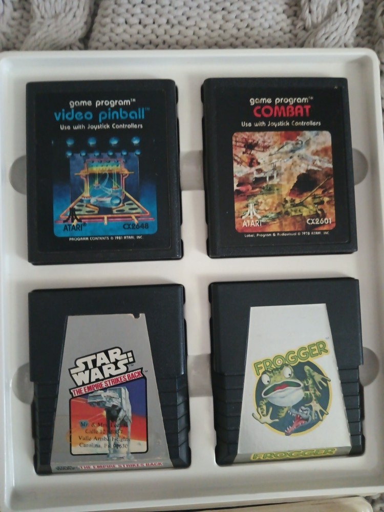 Vintage Atari 2600 Game lot with Atari Original storage cases, untested