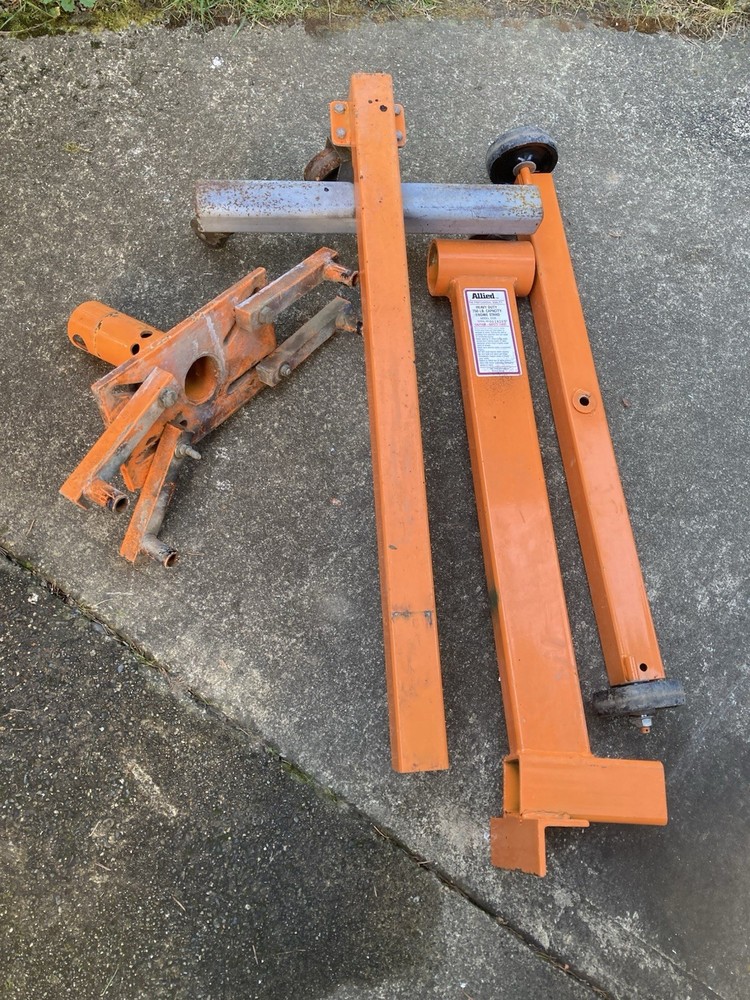 Engine Rebuild Stand Modified for Greater Stability with additional Wheels.