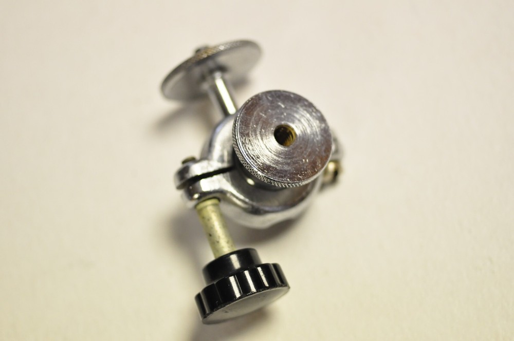 2 1/4" tall ballhead with 1/4" thread at both ends. Well made.