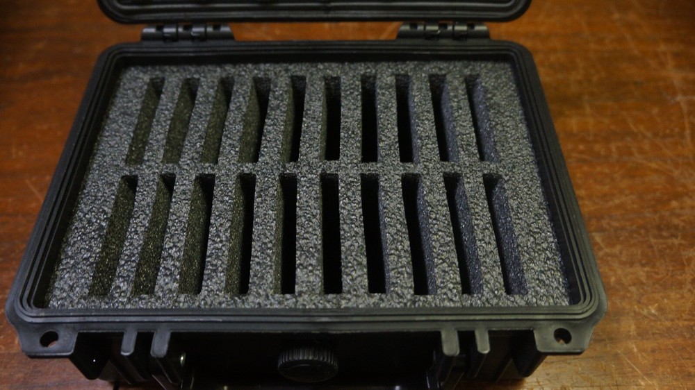 NICE BLACK HARD PLASTIC BOX WITH 20 GRADED COIN SLOTS--DOESNT LOCK TABS SECURE