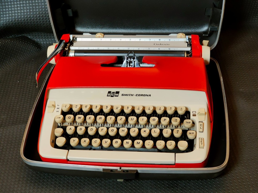red, portable Smith Corona Galaxie typewriter with Cursive / Handwritten Script