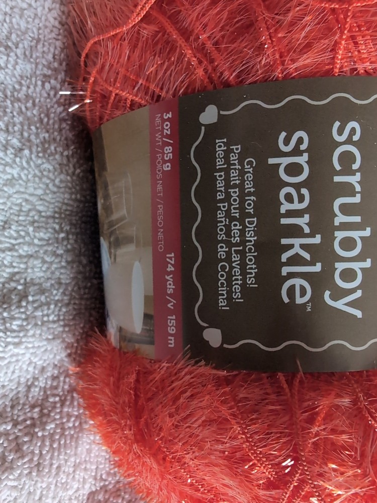 Red Heart SCRUBBY SPARKLE Yarn Polyester. Orange