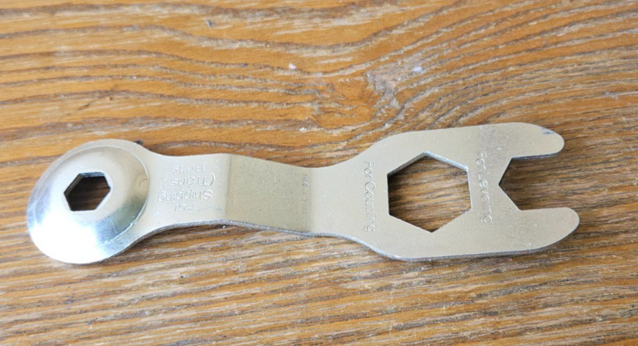 LEVELING, COUPLING, SHIPPING METAL MULTI TOOL.