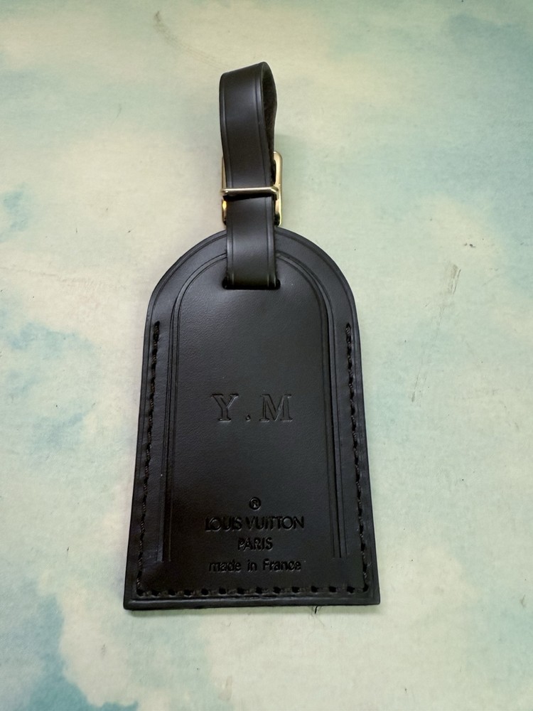 Authentic Louis Vuitton Brown  leather name tag. Initialed YM
