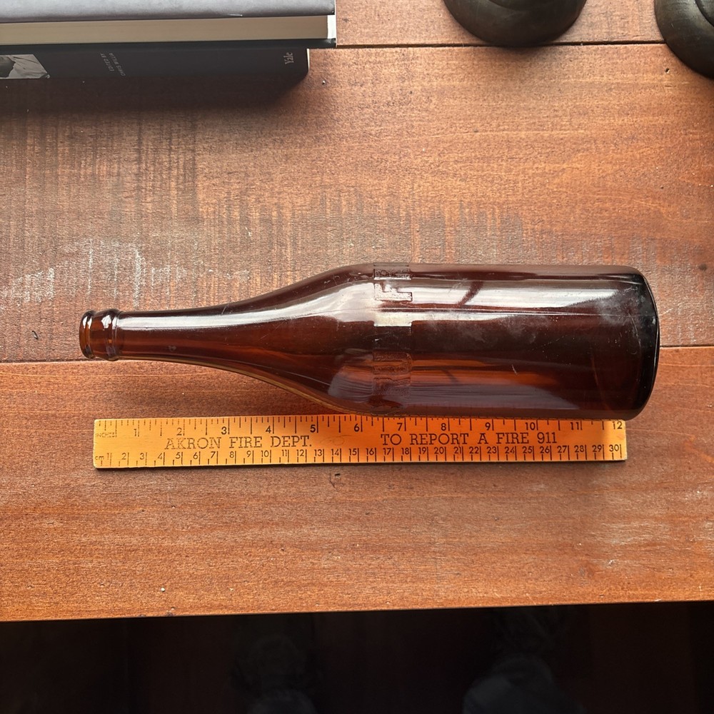 Stains Run From 101 Amber Embossed Bottle