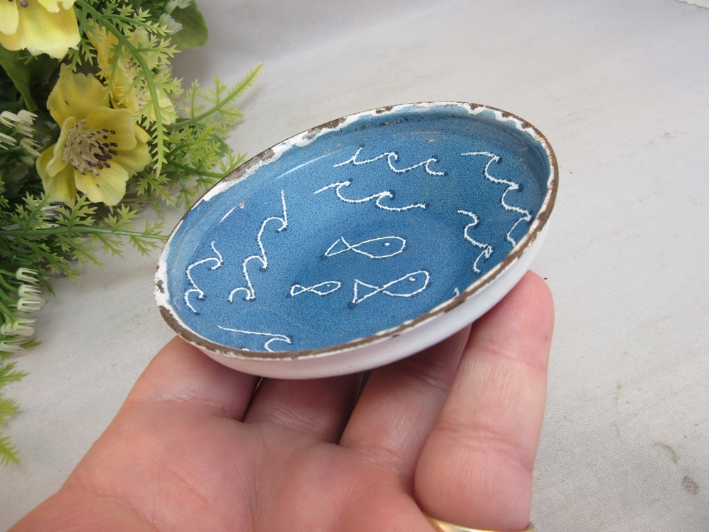 Mid Century enameled dish with fish. Signed WEST