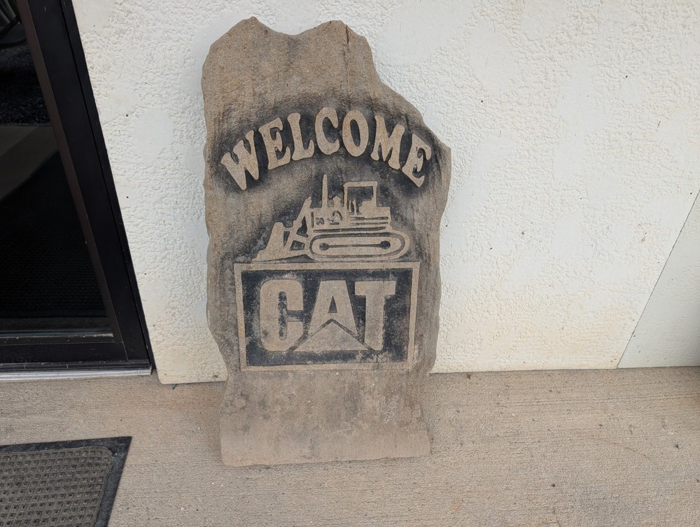 Concrete Caterpillar Welcome Sign