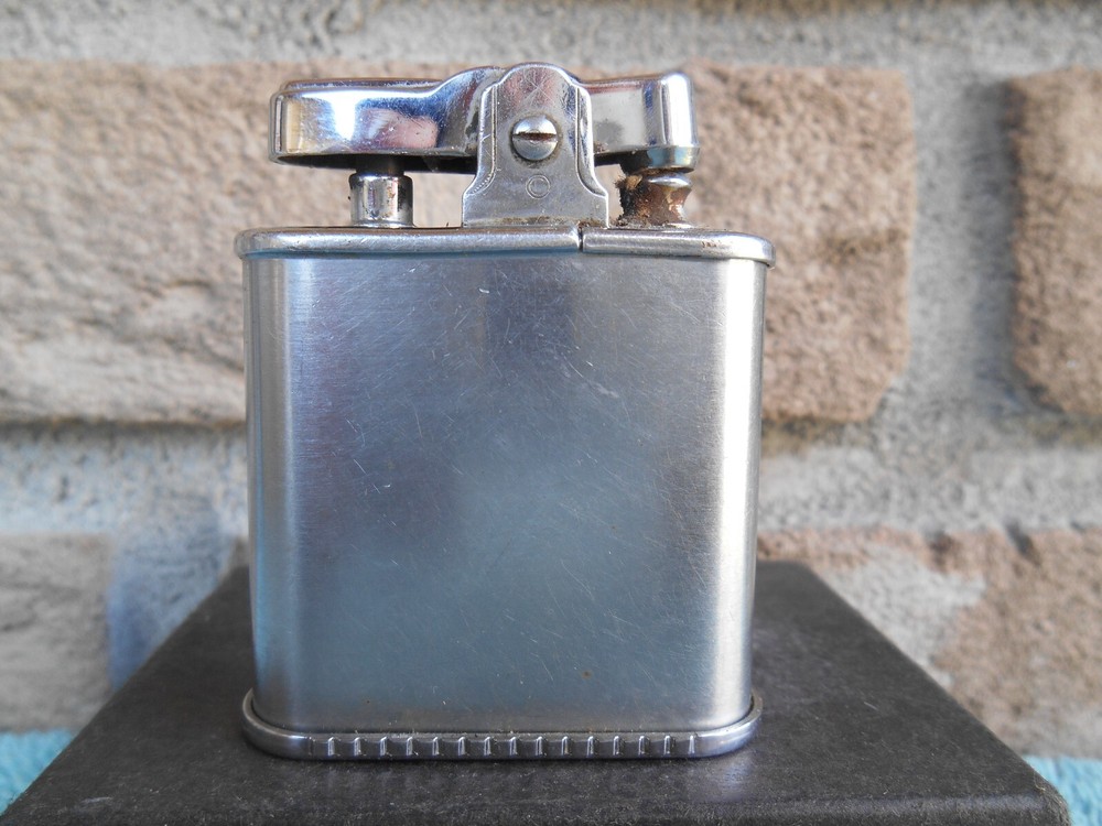 Vintage Ronson WHIRLWIND CHROME CIGARETTE LIGHTER. ETCHED 14TH CENTURY SHIELDS