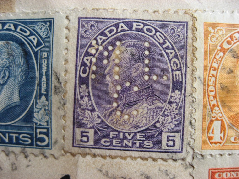 Canada WWII combo cover includes a perfin, cover back damaged
