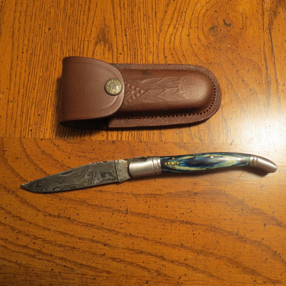 Damascus folding blade knife with blue laminate handle leather sheath hand made