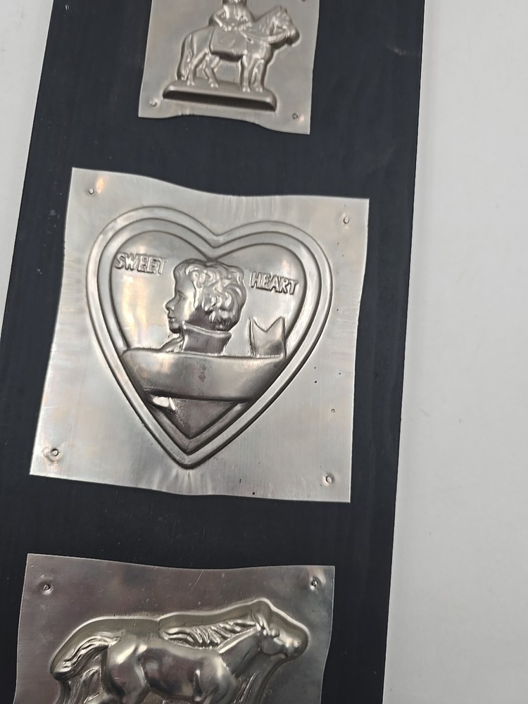 Chocolate Tin Molds On Wood Wall Hanging Display
