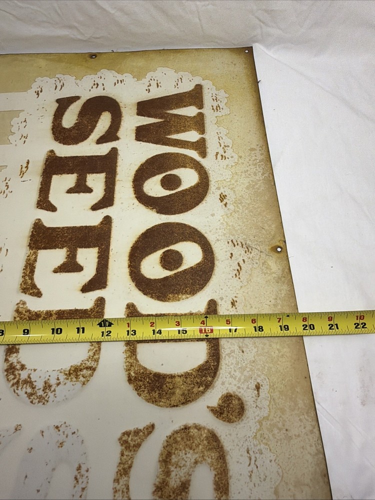 Woods Seeds Embossed Tin Sign