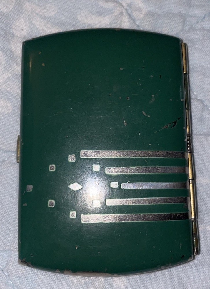 Vintage green cigarette case with decorative silver stripes