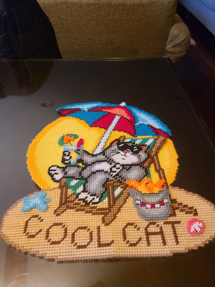 Cross stitch cat at beach on plastic canvas. 3D.