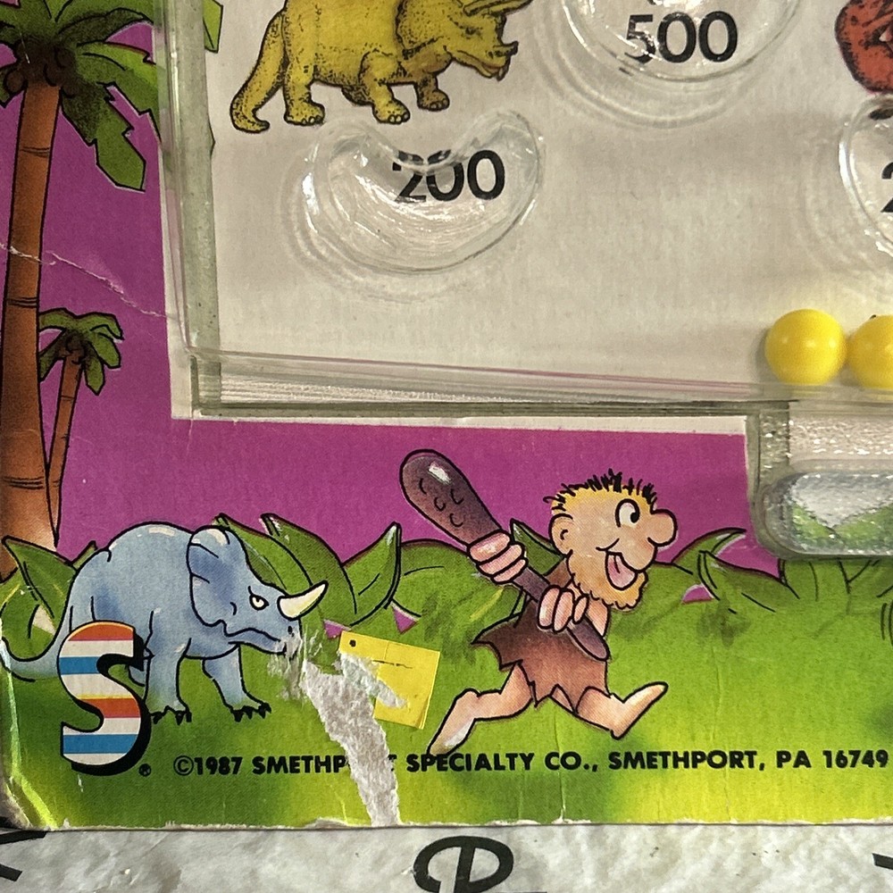 Vintage 1987 Din-o-Flip Handheld Game.
