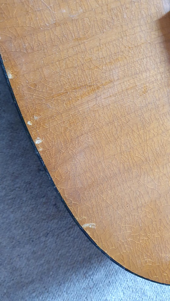 Old guitar with a nicely flamed back, needs service