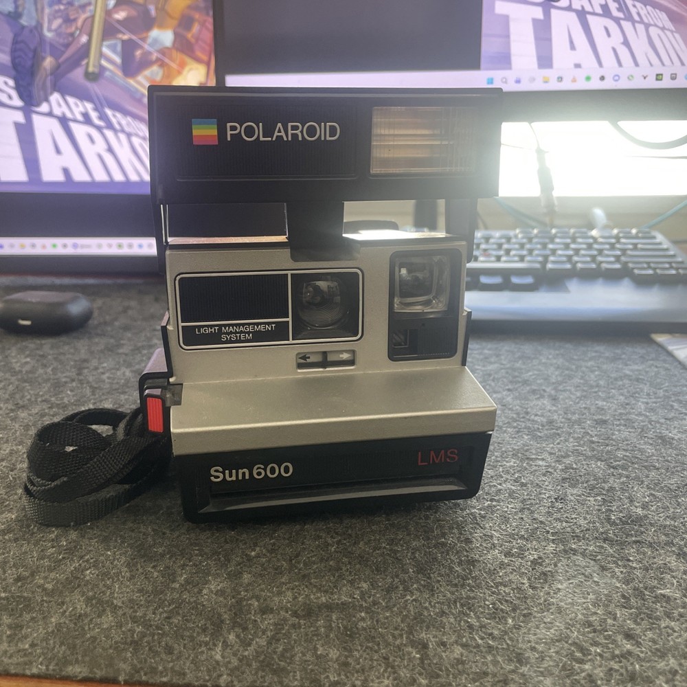 Polaroid Sun 600 LMS, Untested But In Good Condition With Strap