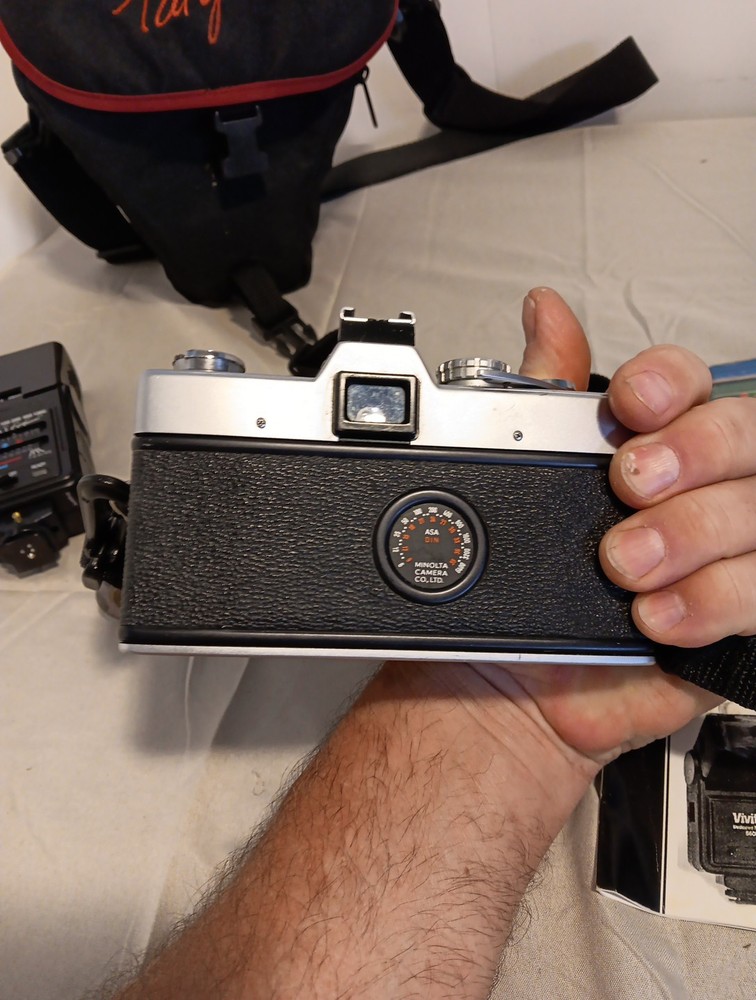 Minolta SRT 200 camera. With Accessories And Paperwork. Untested.