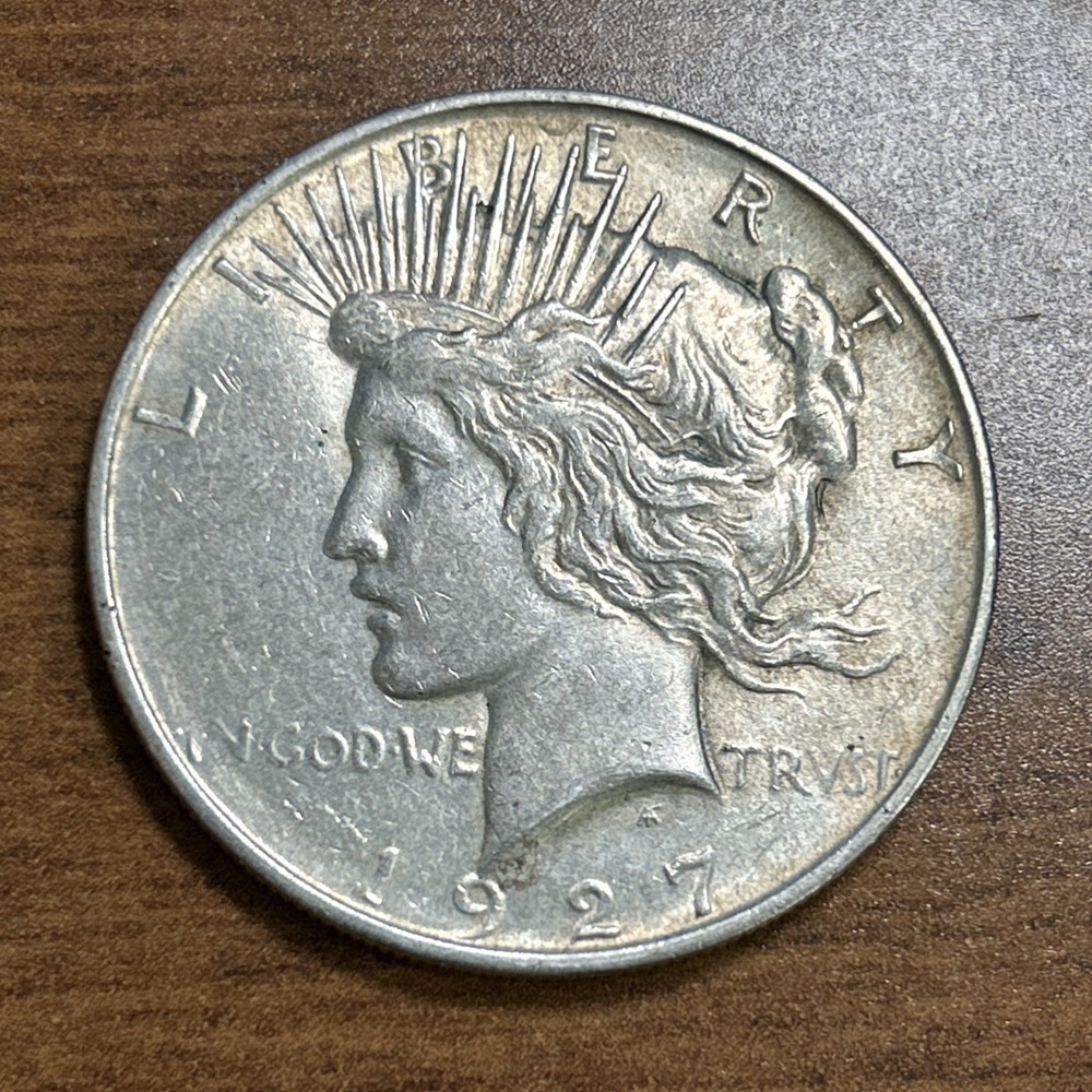 1927-D $1 Peace Silver Dollar AU+