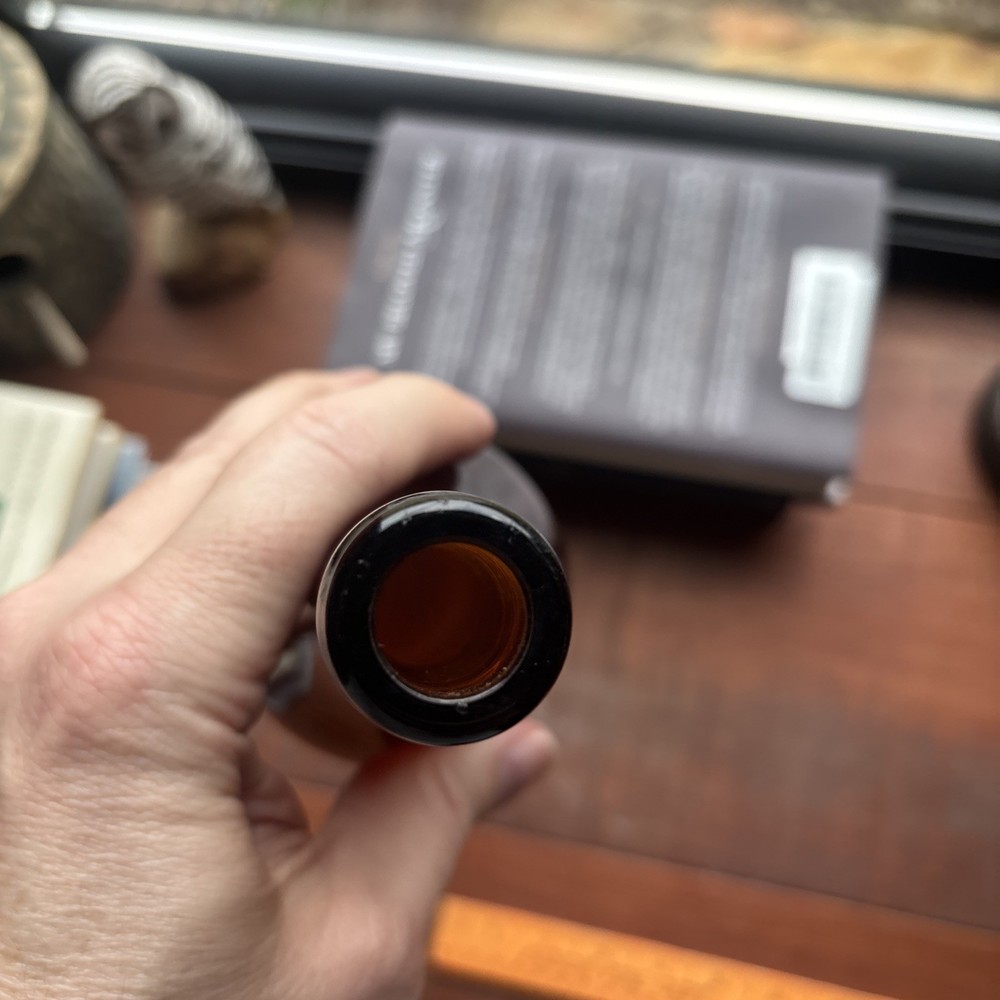 Stains Run From 101 Amber Embossed Bottle