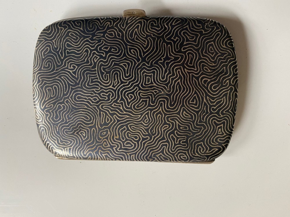 vintage silver cigarette case with gold inlay