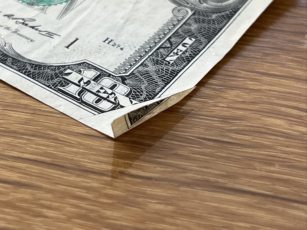 misprint and cut dollar bill