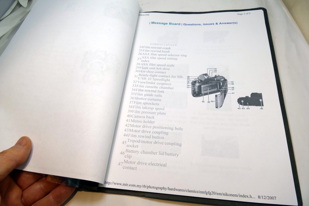 Camera guide instruction manual printed and bound folder for Nikon EM