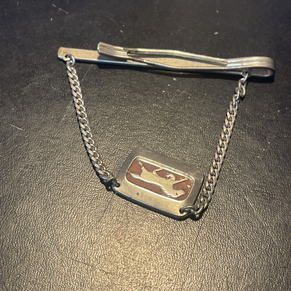 Silvertone clip with horse charm