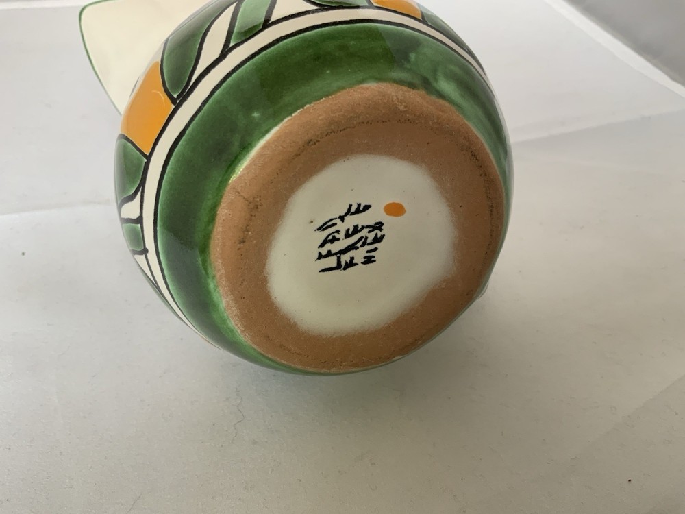 Small ceramic pitcher with floral design Signed