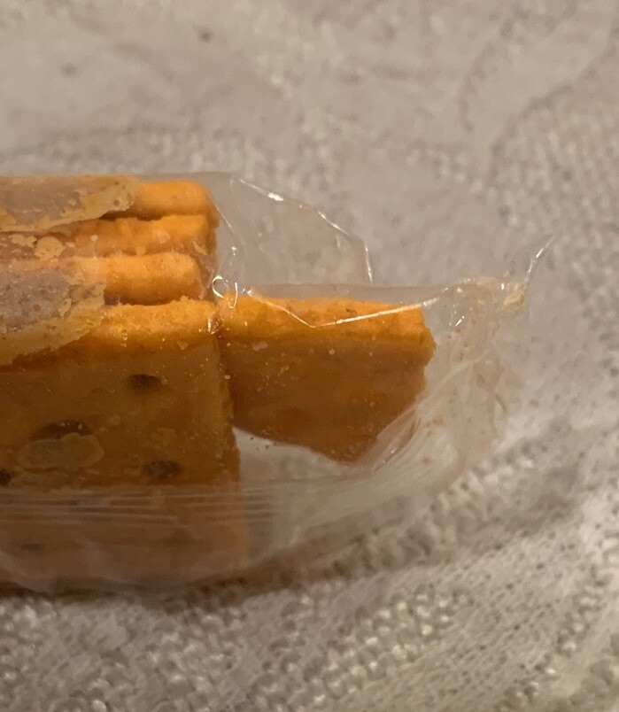 Manufacturing Error Four Pack Of Crackers With Extra Part Of Cracker In Pack